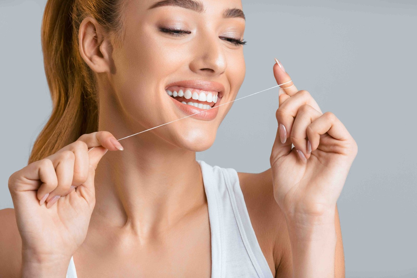 Blog 1 dental floss with veneers